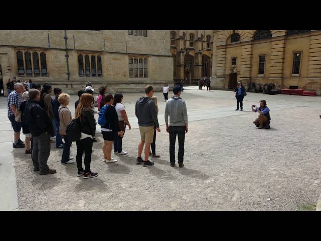 "Jump Man" from Footprints Tours Oxford making people jump around outside the Bodleian Library