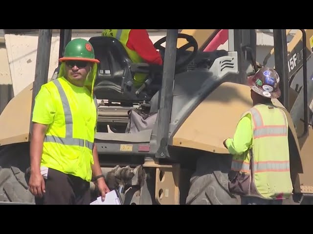 Construction workers power their way through oppressive heat wave