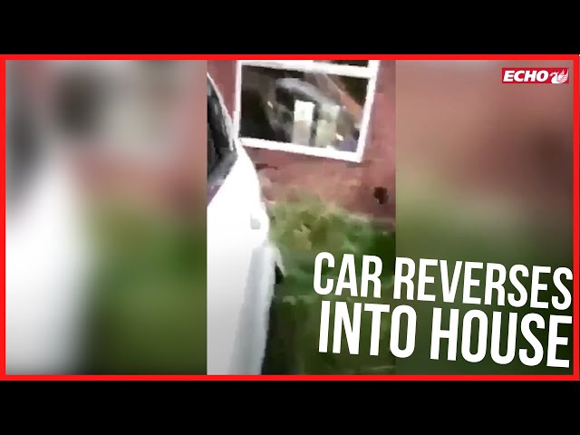 Lads laugh as they reverse car and crash it into house repeatedly while filming it