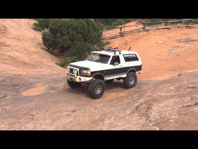 Ford Bronco drives Escalator on Hell's Revenge in Moab Utah.