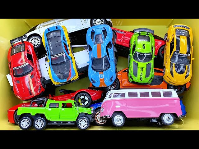 Box full of various miniature cars Peugeot, Volvo, Renault, Hyundai, Pagani, Cadillac One, DHL 13