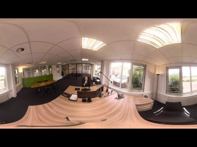 Businessman in office working at computer (4k 360 VR Video)