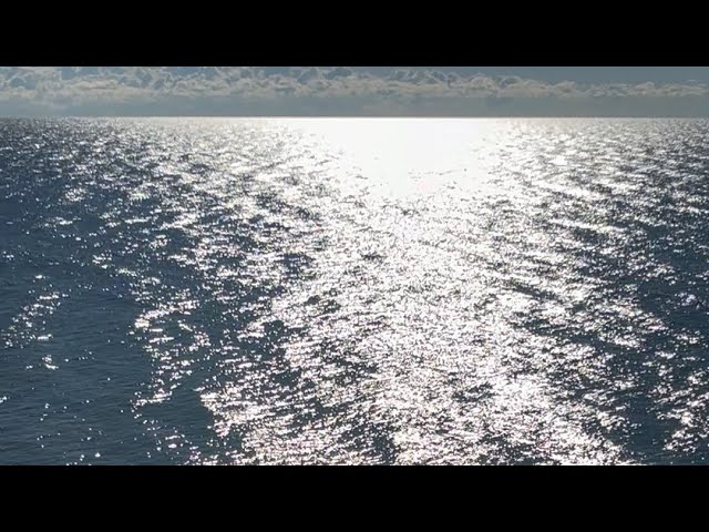 Beautiful Arial View of a Pathway of Shine off a Lake