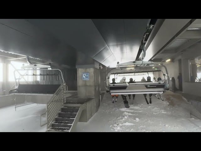 Riding the brand new Canyon Express 6 chair ski lift at Mammoth on a foggy Thursday December 22,2023