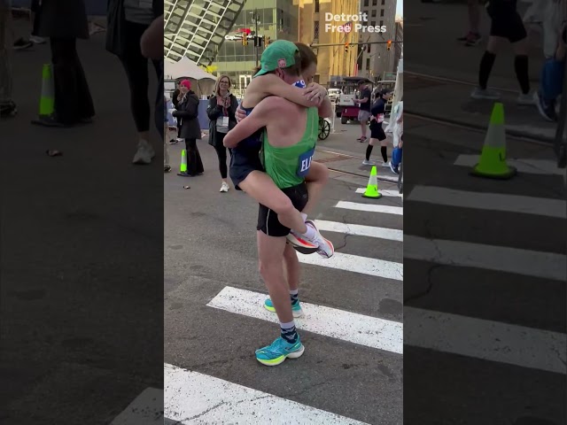 Michigan couple kiss at finish line after winning 2024 Detroit Free Press #marathon