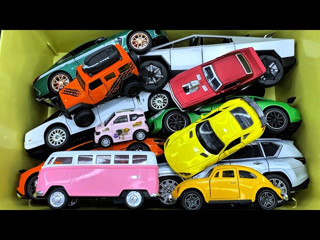 Box full of various miniature cars Peugeot, Volvo, Renault, Hyundai, Pagani, Cadillac One, DHL 14