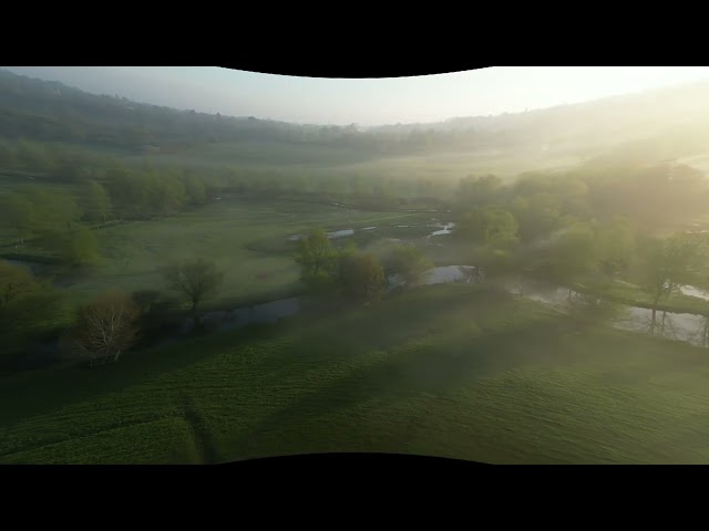 VR180 equidistant fisheye  drone video of a misty morning with sunrays, hyperstereo