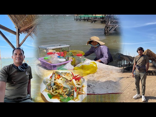 The Pity Grandmother is Selling Papaya Salad In The Riverside In My Country.