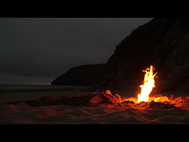 Calming fire, ocean sounds, and soft music for relaxation.