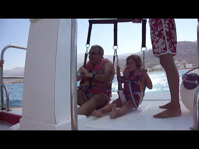 Landing parasailing on boat in Stalida Crete