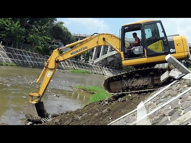 Komatsu PC130F Excavator Climbing Down Slope and River Dam