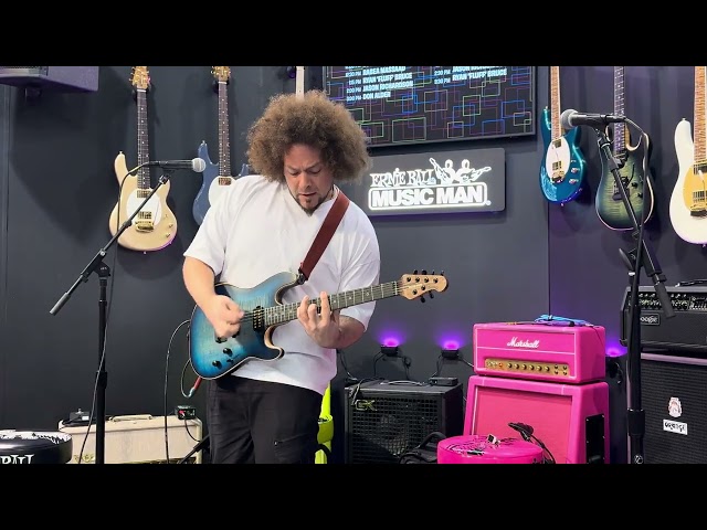 Rebea Massaad-“Growing Pains” 4K UHD Video- Namm 2025-Ernie Ball Booth- Sabre Carian Burst Signature