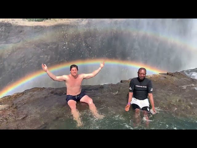 On the edge of a waterfall with rainbows #youtubeshorts #gopro #beautiful