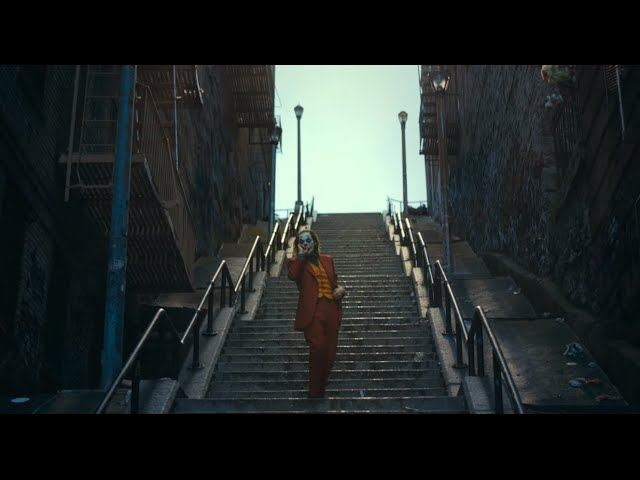 The Joker runs away from the police  (scene on the stairs)