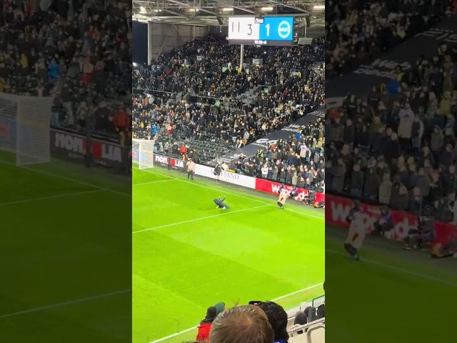 Pitch invader provokes the away end 😂😂