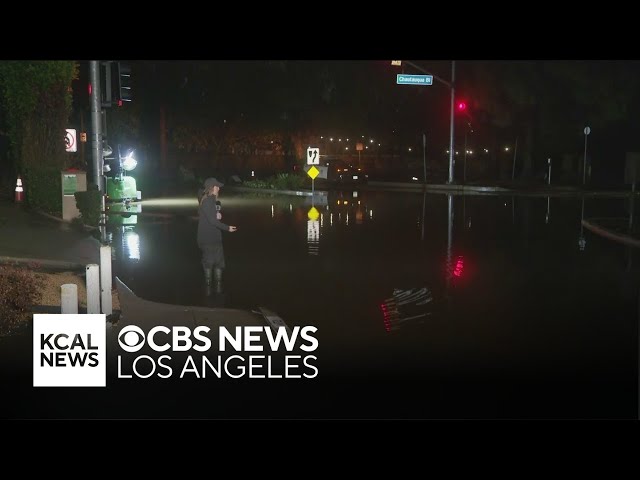 Pools of water fill Pacific Palisades streets as rain passes through LA County