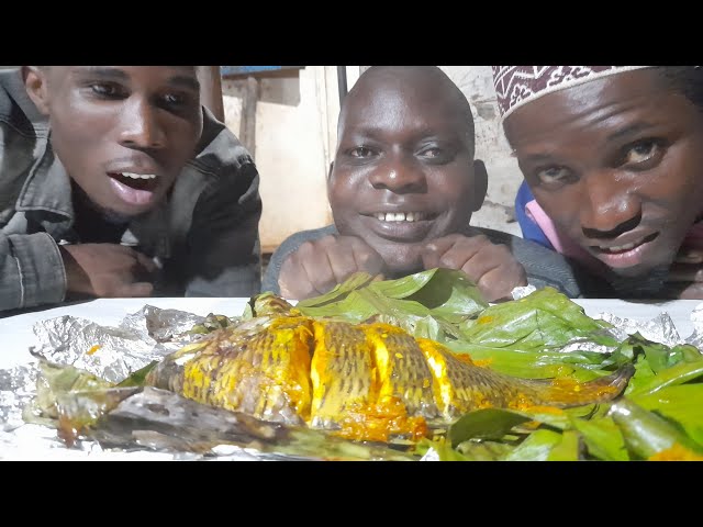 New method of cooking fish inside banana leaves the African way. for lunch or supper.