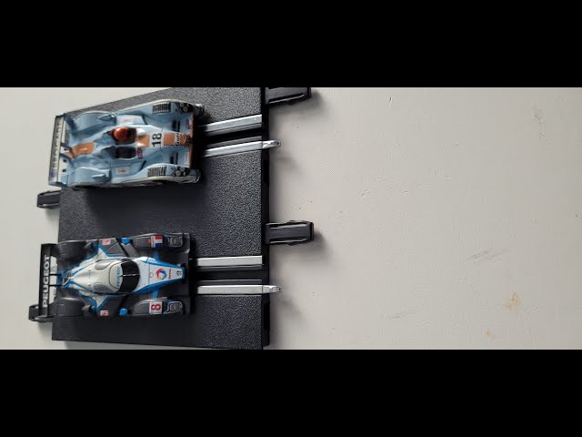 HO cars on Carrera 1:43 scale track.