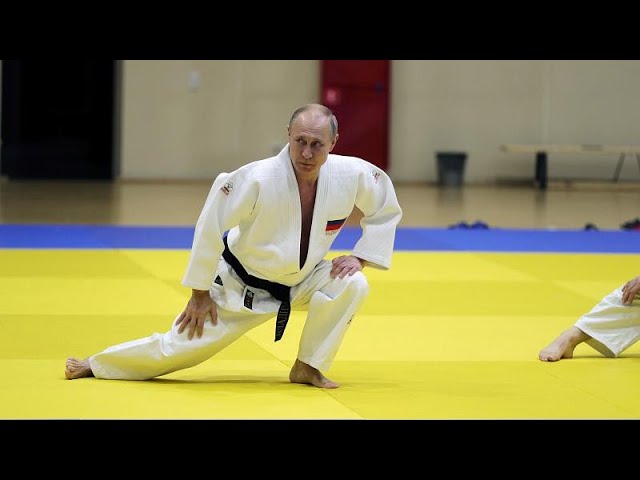 Black belt Putin shows off judo moves with Olympic athletes