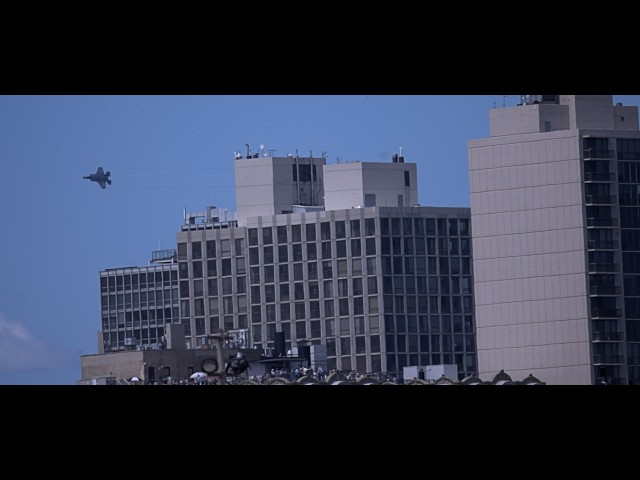 The US Navy Blue Angels soar past the Chicago skyline.