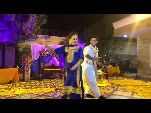 Asma Abbas and Azaan Sami Khan on the dance floor at a engagement ceremony.