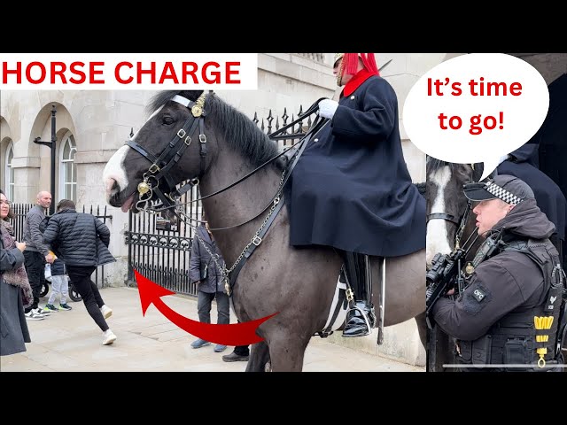 Guard Charges Them With His Horse