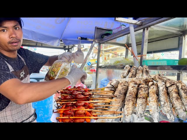 Cambodia street food - Papaya grilled chicken with grilled fish are popular at Toul Pongro Market.