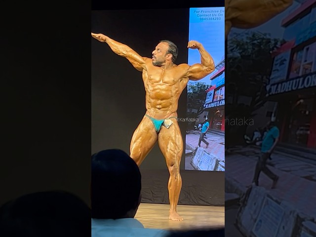 Posing by senior bodybuilder