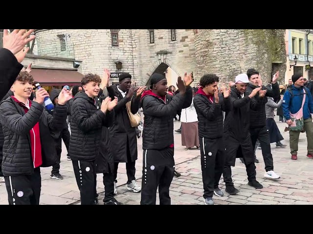 Hare Krishna Kirtan attracts football team to dance in ecstasy. Tallinn, Estonia, Europe.