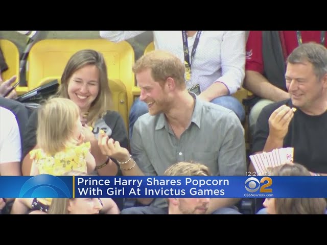 Prince Harry Shares Popcorn With Little Girl