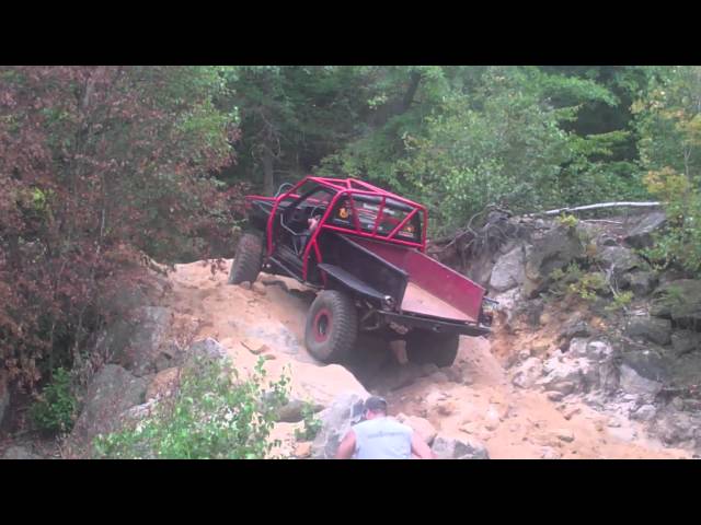 Caged & Turbo'd Yota climbing rocks