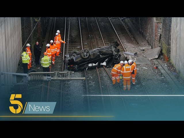 Major disruption on railways between Manchester and Liverpool after a car crashed onto the tracks