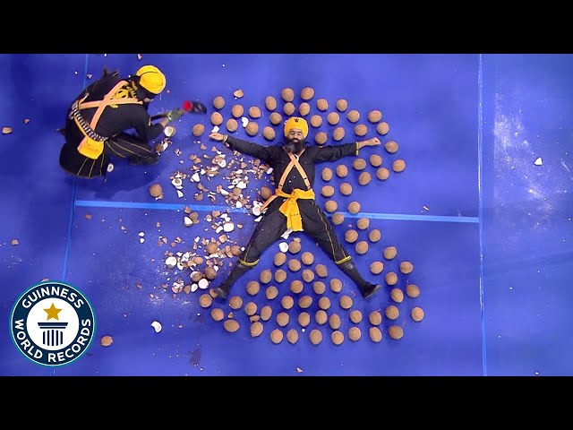 Most Coconuts Smashed Around A Person Whilst Blindfolded - Guinness World Records