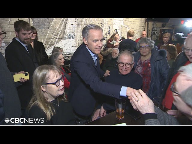 Liberal leadership candidate Mark Carney greets supporters at Winnipeg’s King’s Head Pub