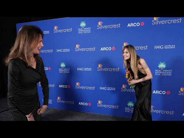 Angelina Jolie receives an award from godmother Jacqueline Bisset at Palm Springs Film Festival.