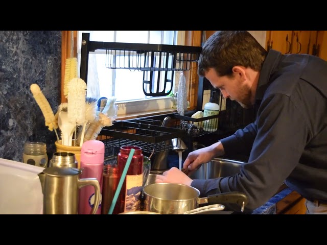 Man washes dishes