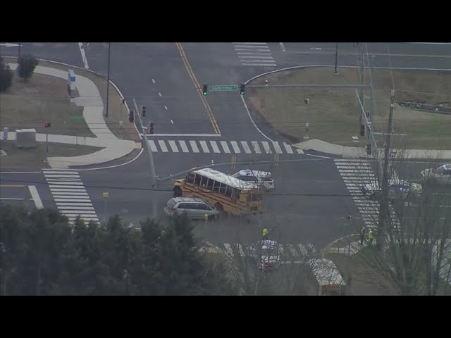 Crash between school bus, minivan sends 1 to hospital