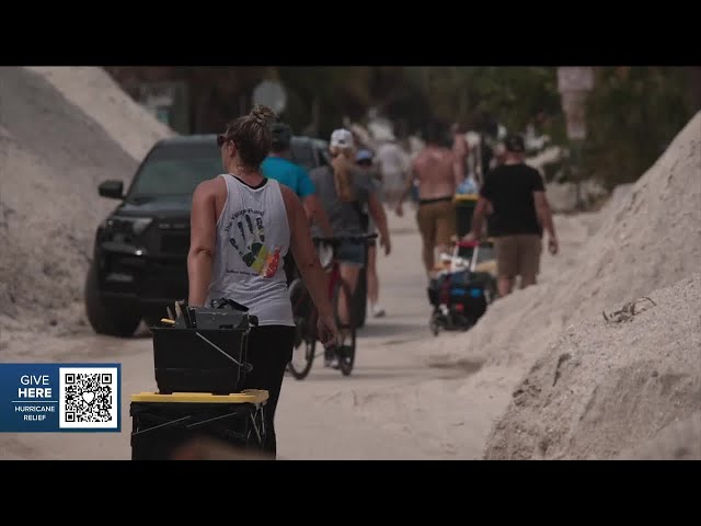 Emotions boil over with FEMA as residents in Treasure Island walk miles in heat to carry in supplies