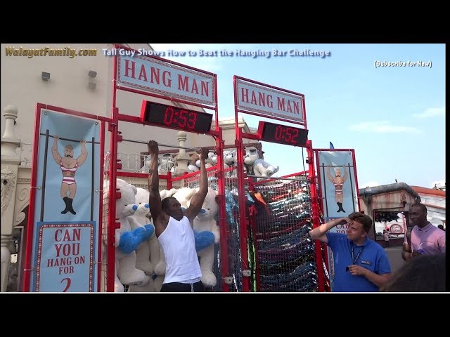 Tall Guy Shows How to Beat Bar Hang Challenge! Hold On For Two Minutes To Win!