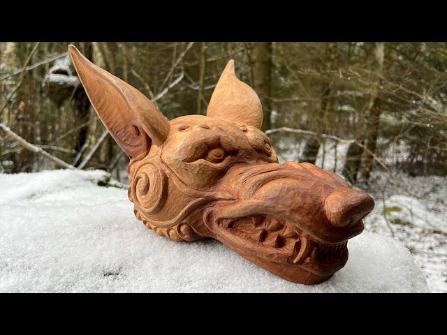 Wood carving. Wolf's head.