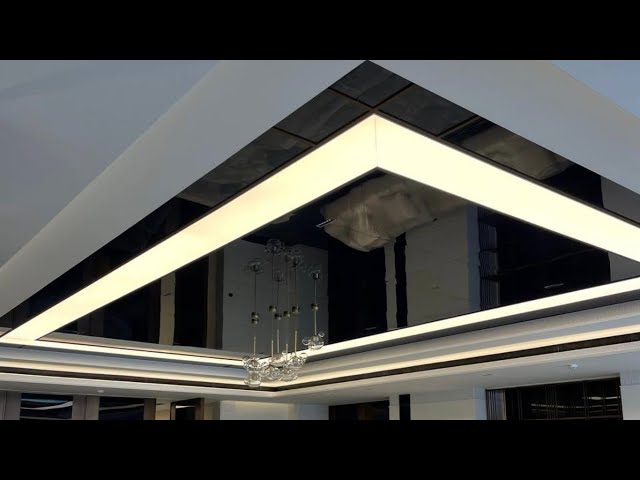 Stretch ceiling black mirror with decorative light bulbs