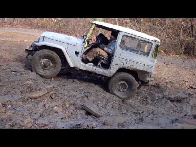 Toyota 1971 FJ40 climbing up a creek