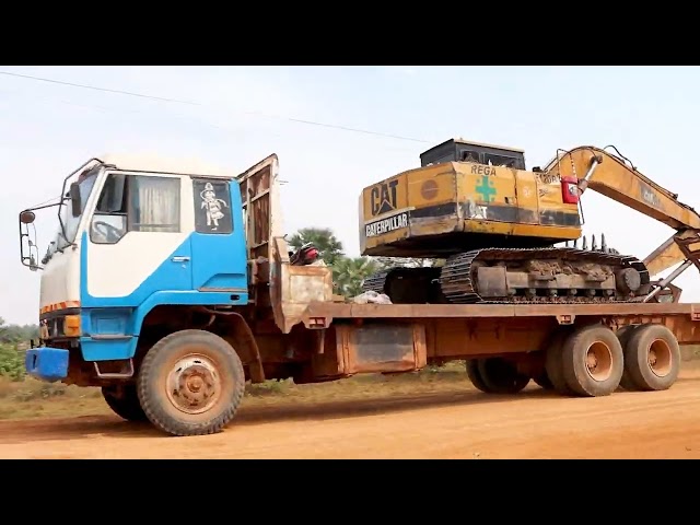 Trailer Transporting Excavator and Heavy Machinery Working With Best Operation Driver