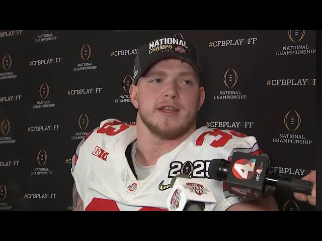 Ohio State football players praising Jesus after winning the national championship