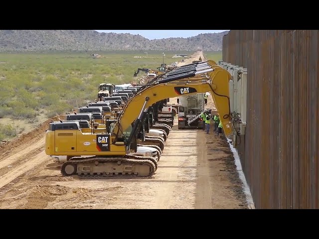 Engineers Construct Border Barriers Using Heavy Machinery