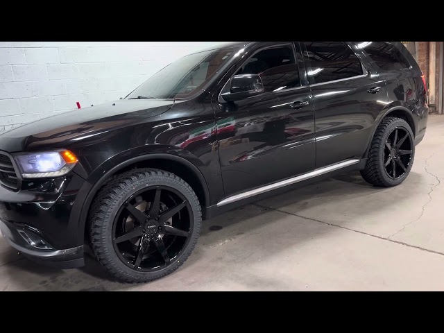 DODGE DURANGO 22” GLOSS BLACK 7 SPOKE WHEELS ON ALL TERRAIN TIRES