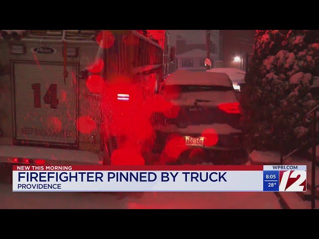 Firefighter pinned between vehicles