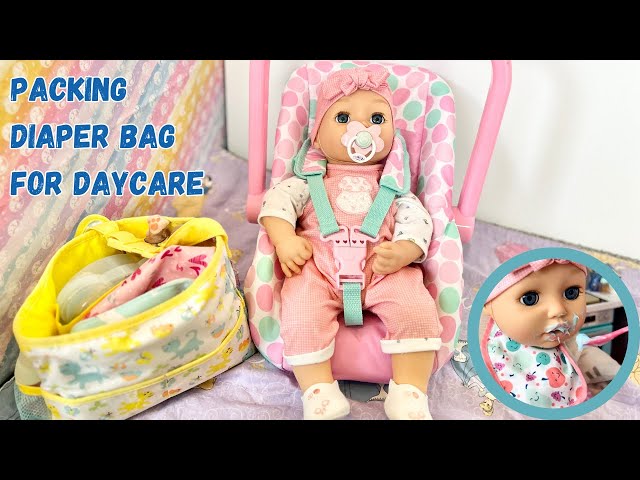 Baby Annabell Doll packing diaper bag, feeding, and changing diaper