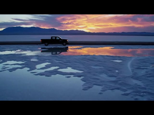 A pickup truck driving through an empty highway in the Utah Bonneville Salt flats. #AI #sora