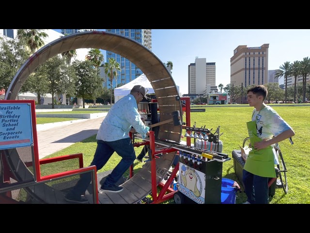 Making a sno-cone on a human-sized hamster wheel